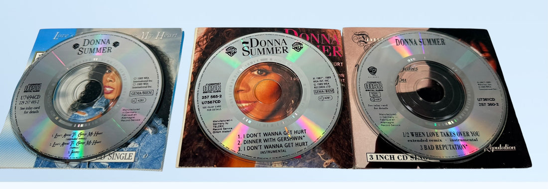 Vintage Donna Summer 3-inch CD singles lot, late 1980s WEA Germany pressings including one sealed copy. Collectible mini CD pop format set.