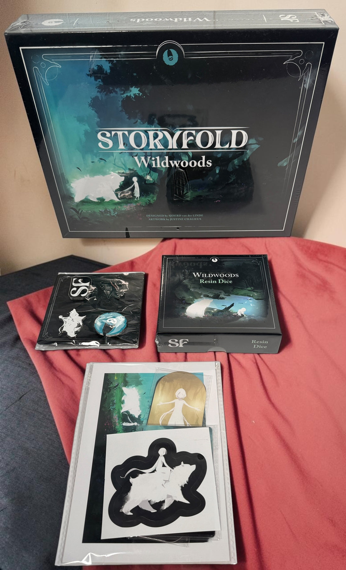 Storyfold: Wildwoods sealed solo board game bundle with resin dice, neoprene playmat, enamel pins and Kickstarter Exclusive Pack by Open Owl Studios.