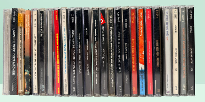 Large Depeche Mode CD lot with 28 discs including Violator, Black Celebration, 101, singles, remixes, and sealed copies. Complete fan collection bundle.