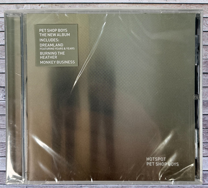 Sealed 2020 EU CD of Pet Shop Boys Hotspot featuring Dreamland and Burning the Heather. Standard jewel case edition in factory shrink wrap.