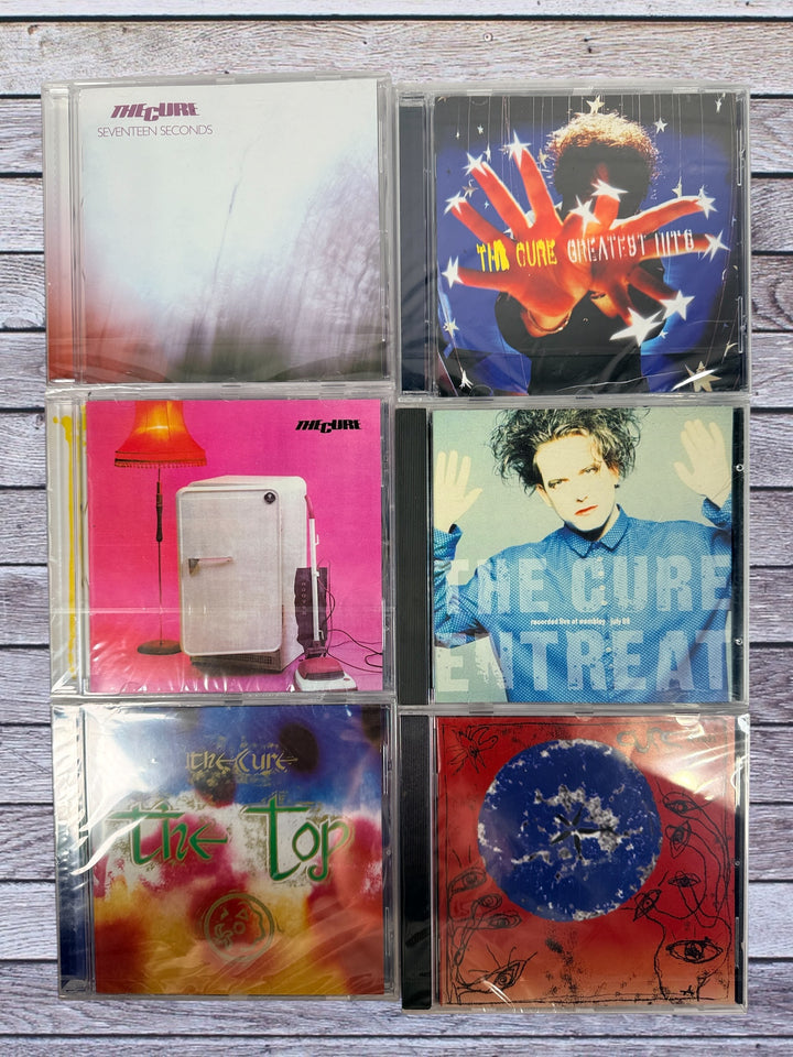 The Cure 6 CD lot featuring Seventeen Seconds, Wish, Entreat and more. Classic alternative and post-punk albums in clean condition.