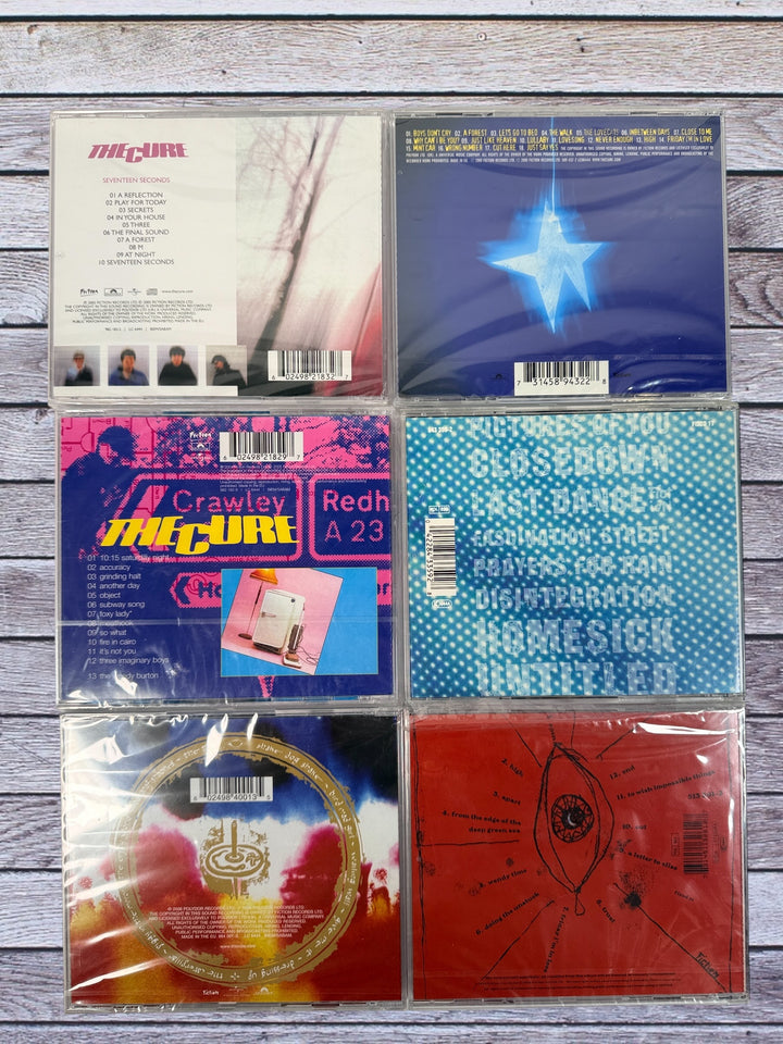 The Cure 6 CD lot featuring Seventeen Seconds, Wish, Entreat and more. Classic alternative and post-punk albums in clean condition.
