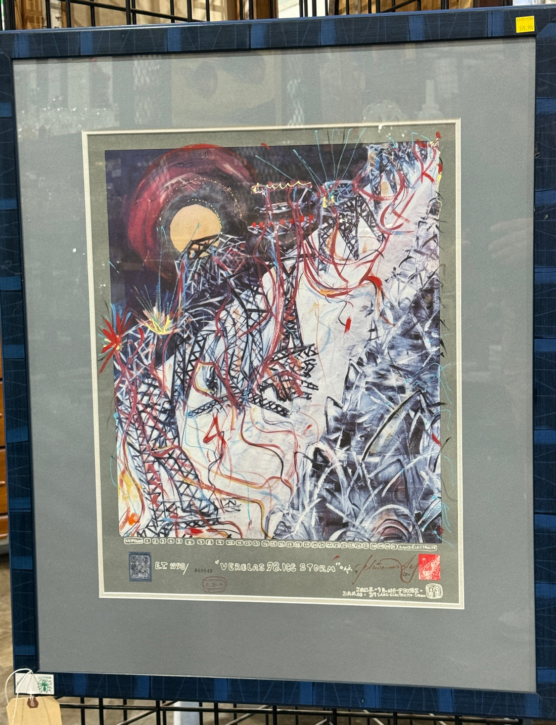 Framed abstract artwork with a signature in the corner
