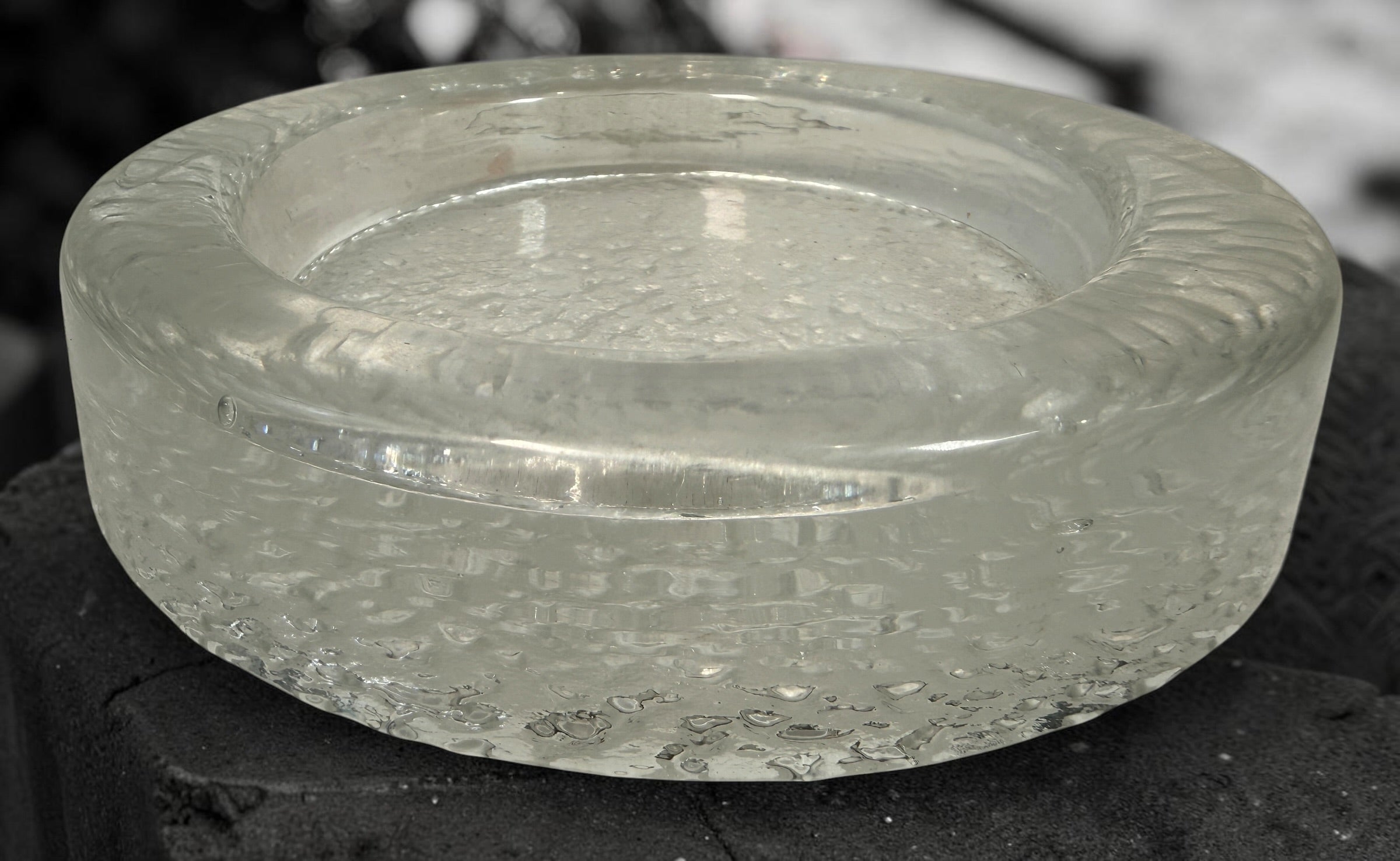 Vintage Iittala Visa clear glass ashtray designed by Timo Sarpaneva in Finland. Sculptural Scandinavian modern art glass with ice-textured finish.