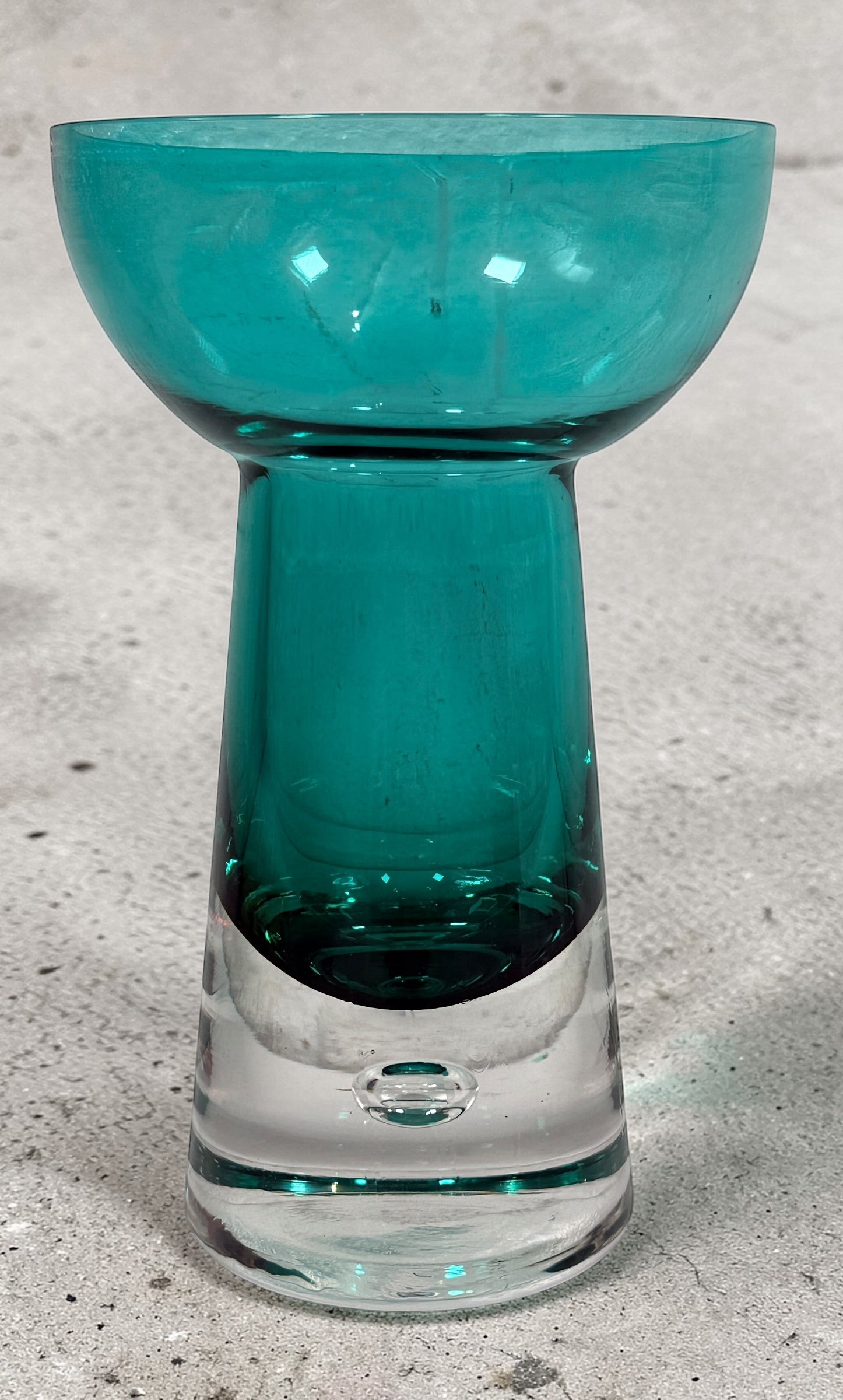 Mid century modern teal art glass pedestal bowl with heavy clear base. Scandinavian style decorative centerpiece perfect for modern or vintage interiors.