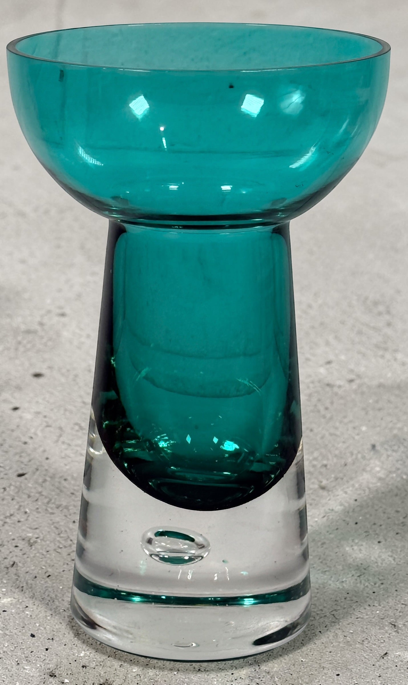 Mid century modern teal art glass pedestal bowl with heavy clear base. Scandinavian style decorative centerpiece perfect for modern or vintage interiors.