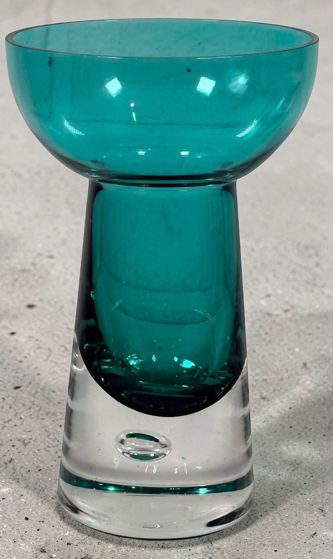 Mid century modern teal art glass pedestal bowl with heavy clear base. Scandinavian style decorative centerpiece perfect for modern or vintage interiors.