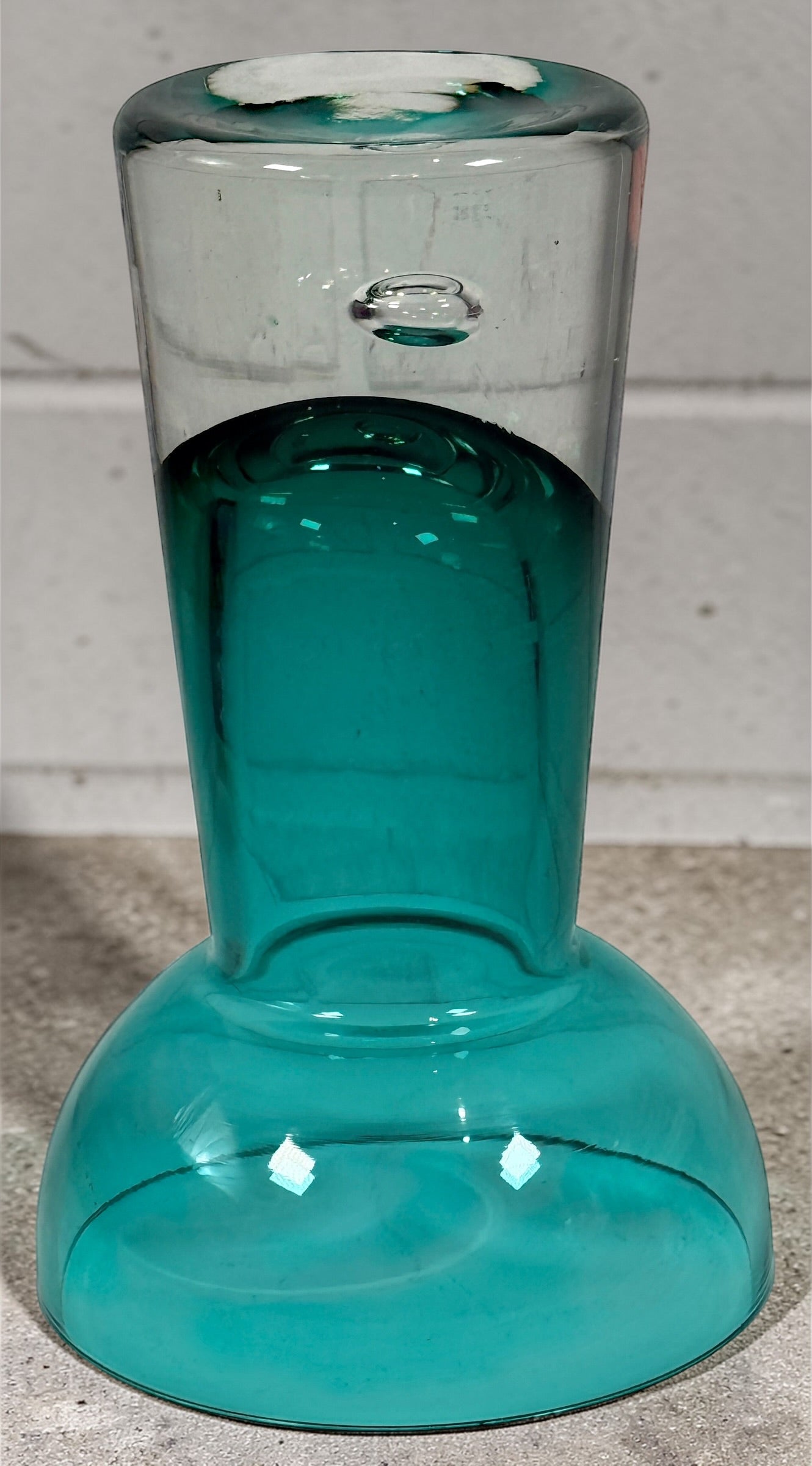Mid century modern teal art glass pedestal bowl with heavy clear base. Scandinavian style decorative centerpiece perfect for modern or vintage interiors.