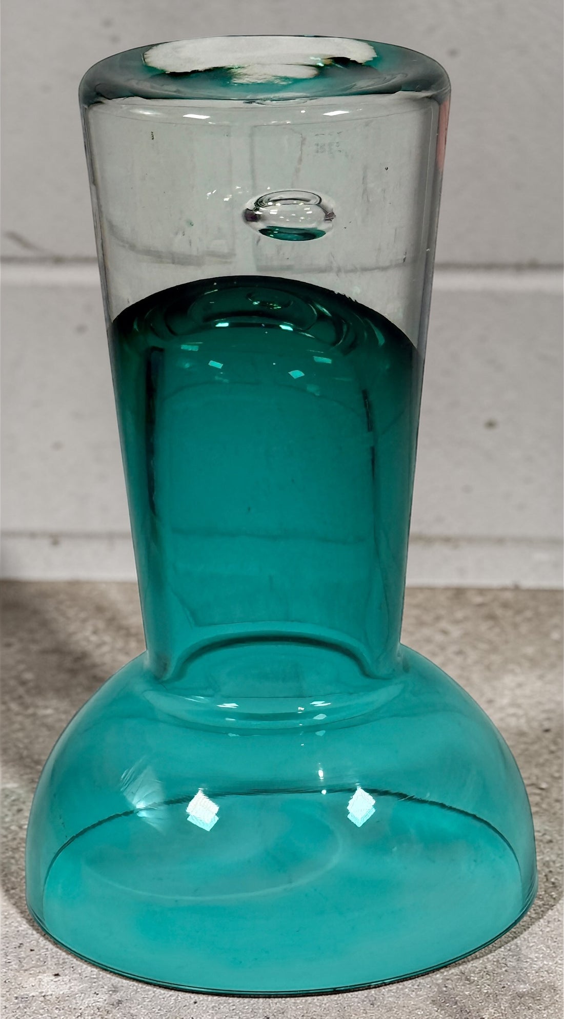 Mid century modern teal art glass pedestal bowl with heavy clear base. Scandinavian style decorative centerpiece perfect for modern or vintage interiors.
