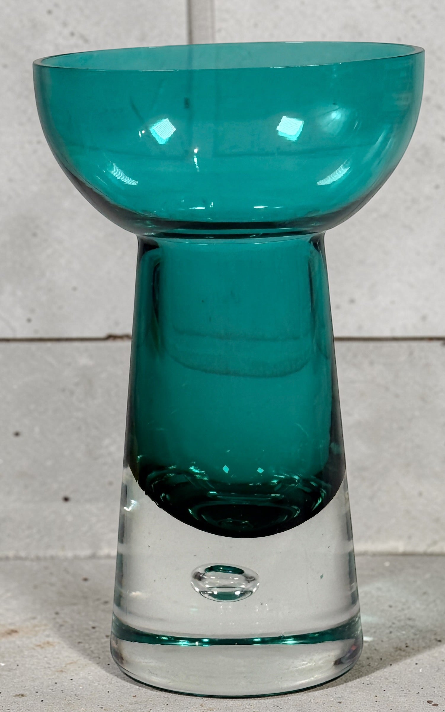 Mid century modern teal art glass pedestal bowl with heavy clear base. Scandinavian style decorative centerpiece perfect for modern or vintage interiors.