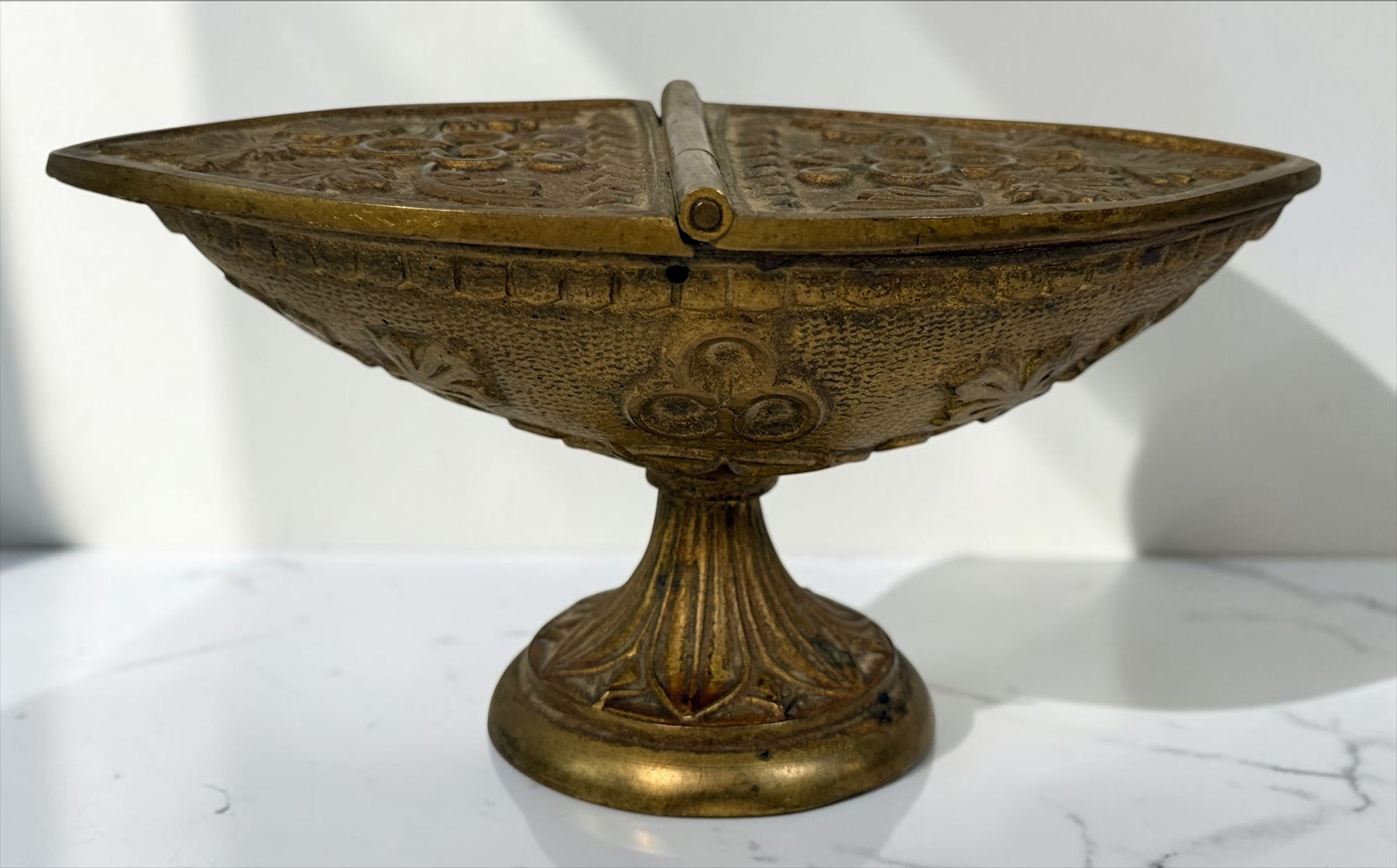 Antique brass liturgical incense boat/navicula with hinged lids, pedestal base and embossed grapevine decoration. Ecclesiastical religious collectible.
