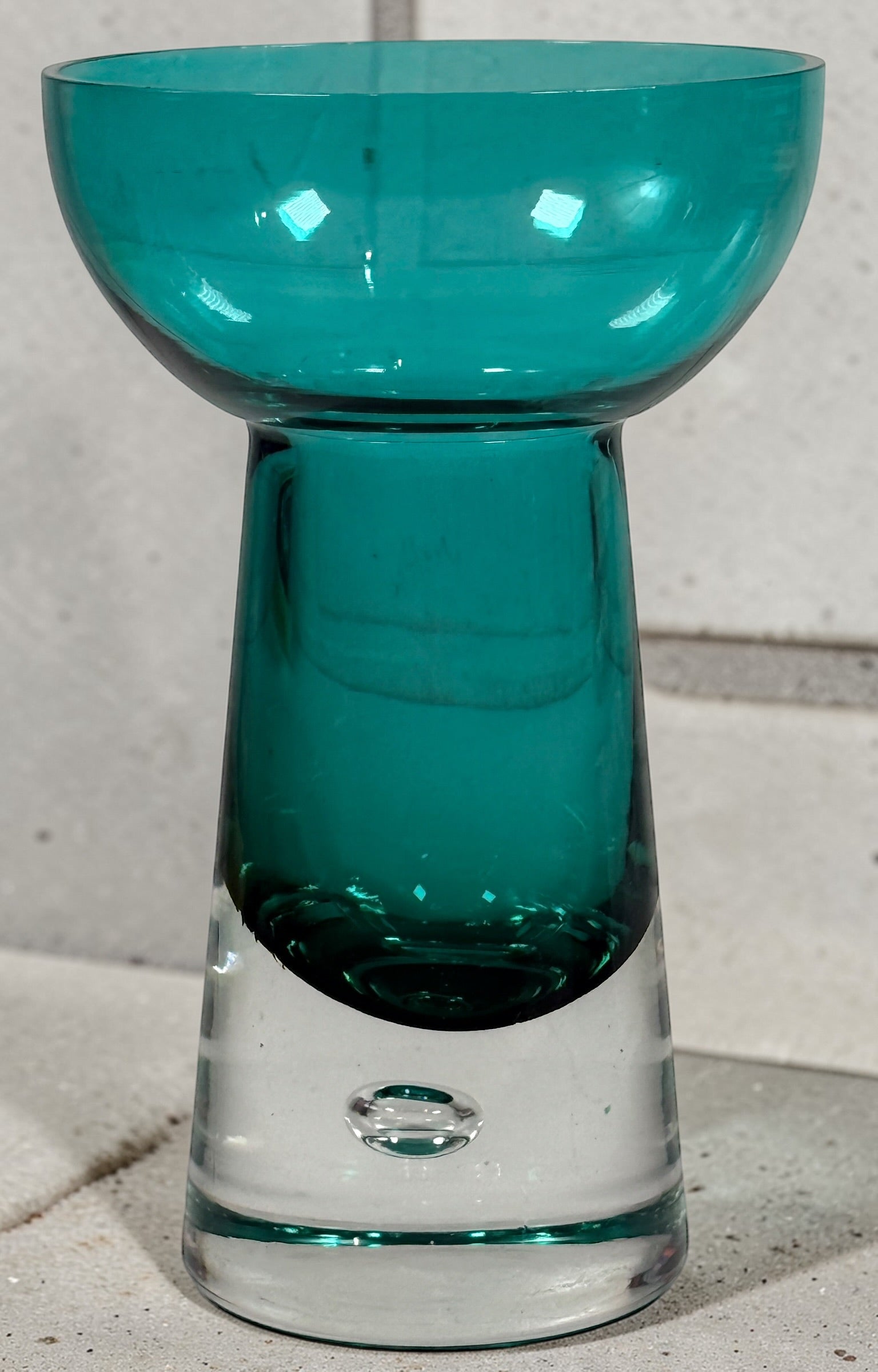 Mid century modern teal art glass pedestal bowl with heavy clear base. Scandinavian style decorative centerpiece perfect for modern or vintage interiors.