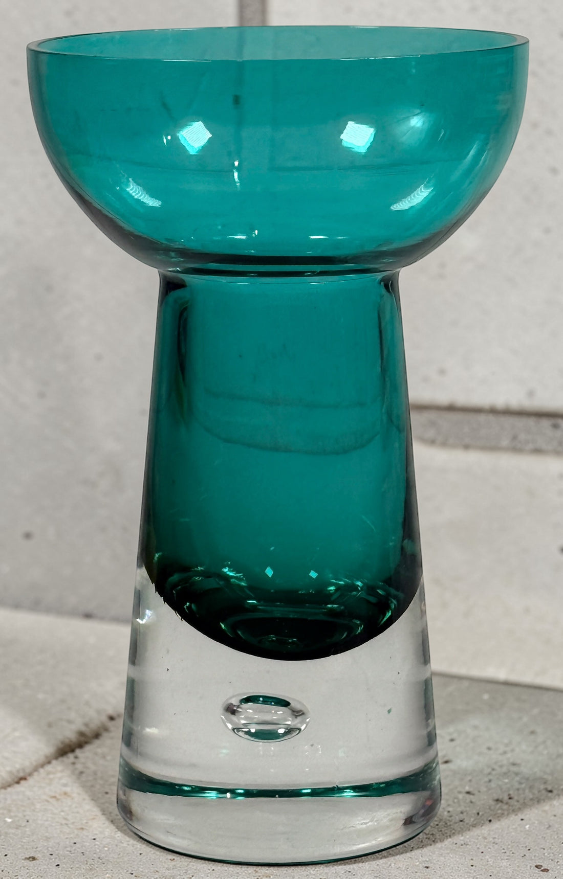 Mid century modern teal art glass pedestal bowl with heavy clear base. Scandinavian style decorative centerpiece perfect for modern or vintage interiors.