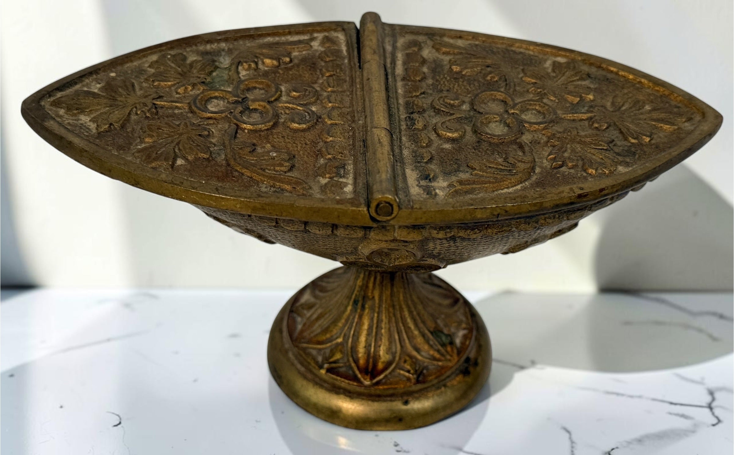 Antique brass liturgical incense boat/navicula with hinged lids, pedestal base and embossed grapevine decoration. Ecclesiastical religious collectible.