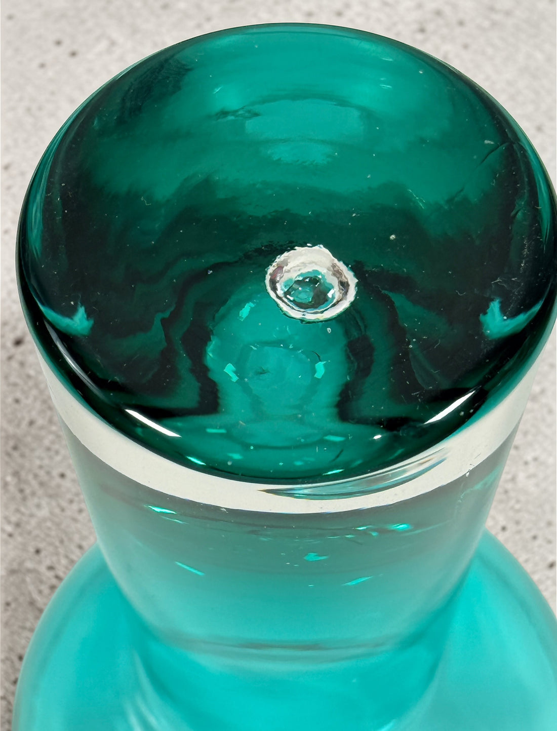 Mid century modern teal art glass pedestal bowl with heavy clear base. Scandinavian style decorative centerpiece perfect for modern or vintage interiors.