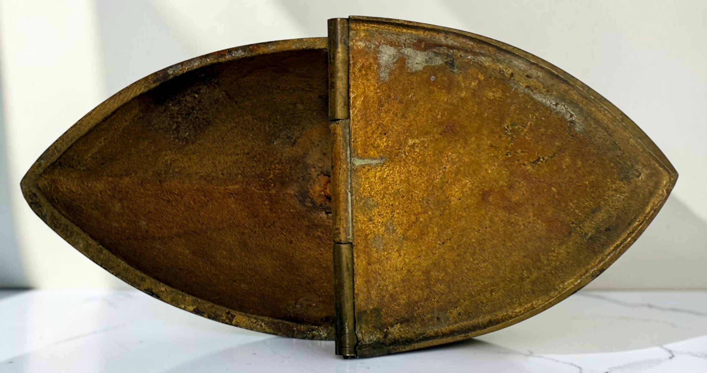 Antique brass liturgical incense boat/navicula with hinged lids, pedestal base and embossed grapevine decoration. Ecclesiastical religious collectible.