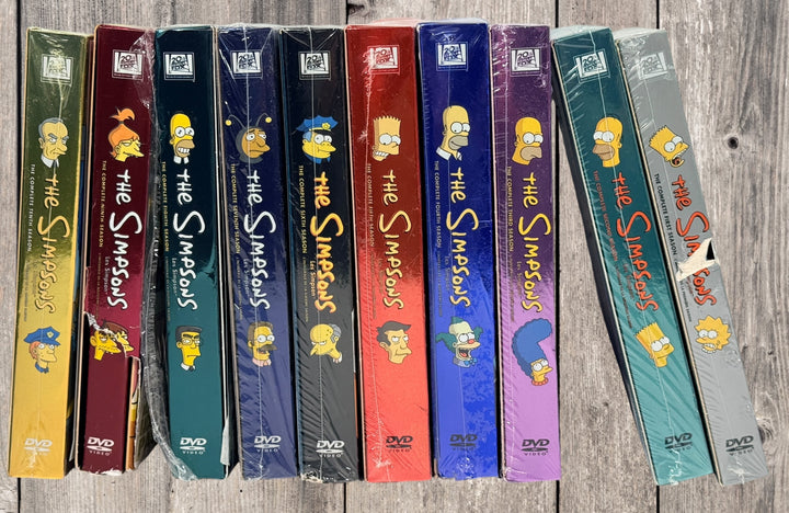 Simpsons complete seasons 1-10 DVD collector box set, mostly sealed early series release. Great for collectors, nostalgia fans, or classic TV media buyers.