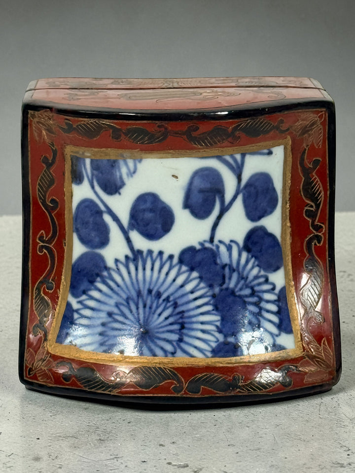 Chinese lacquer jewelry box with porcelain floral panel, red and gold decorative trinket box, vintage Asian decor storage piece, elegant display accent.