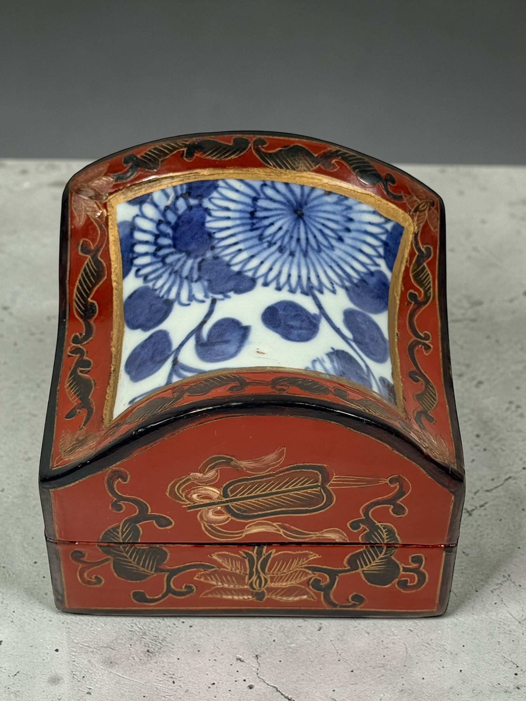 Chinese lacquer jewelry box with porcelain floral panel, red and gold decorative trinket box, vintage Asian decor storage piece, elegant display accent.