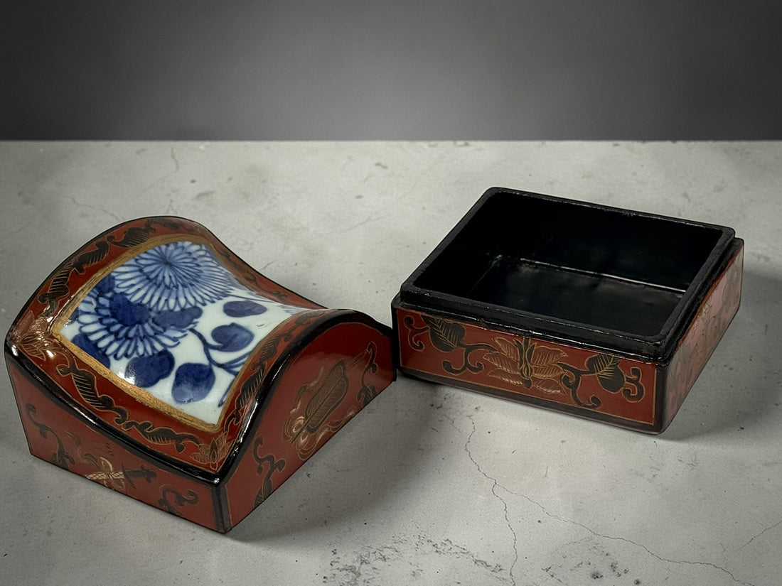 Chinese lacquer jewelry box with porcelain floral panel, red and gold decorative trinket box, vintage Asian decor storage piece, elegant display accent.