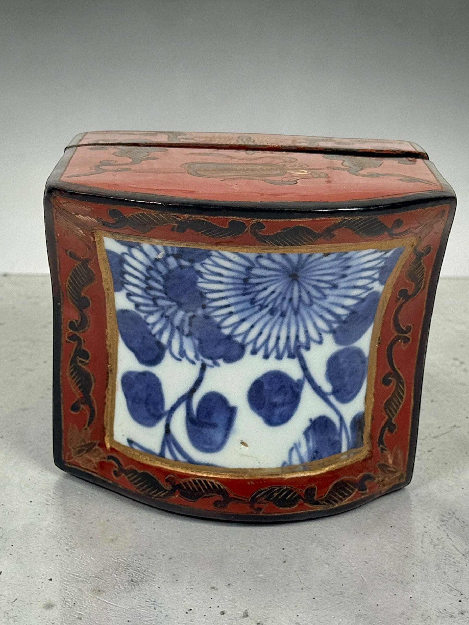 Chinese lacquer jewelry box with porcelain floral panel, red and gold decorative trinket box, vintage Asian decor storage piece, elegant display accent.