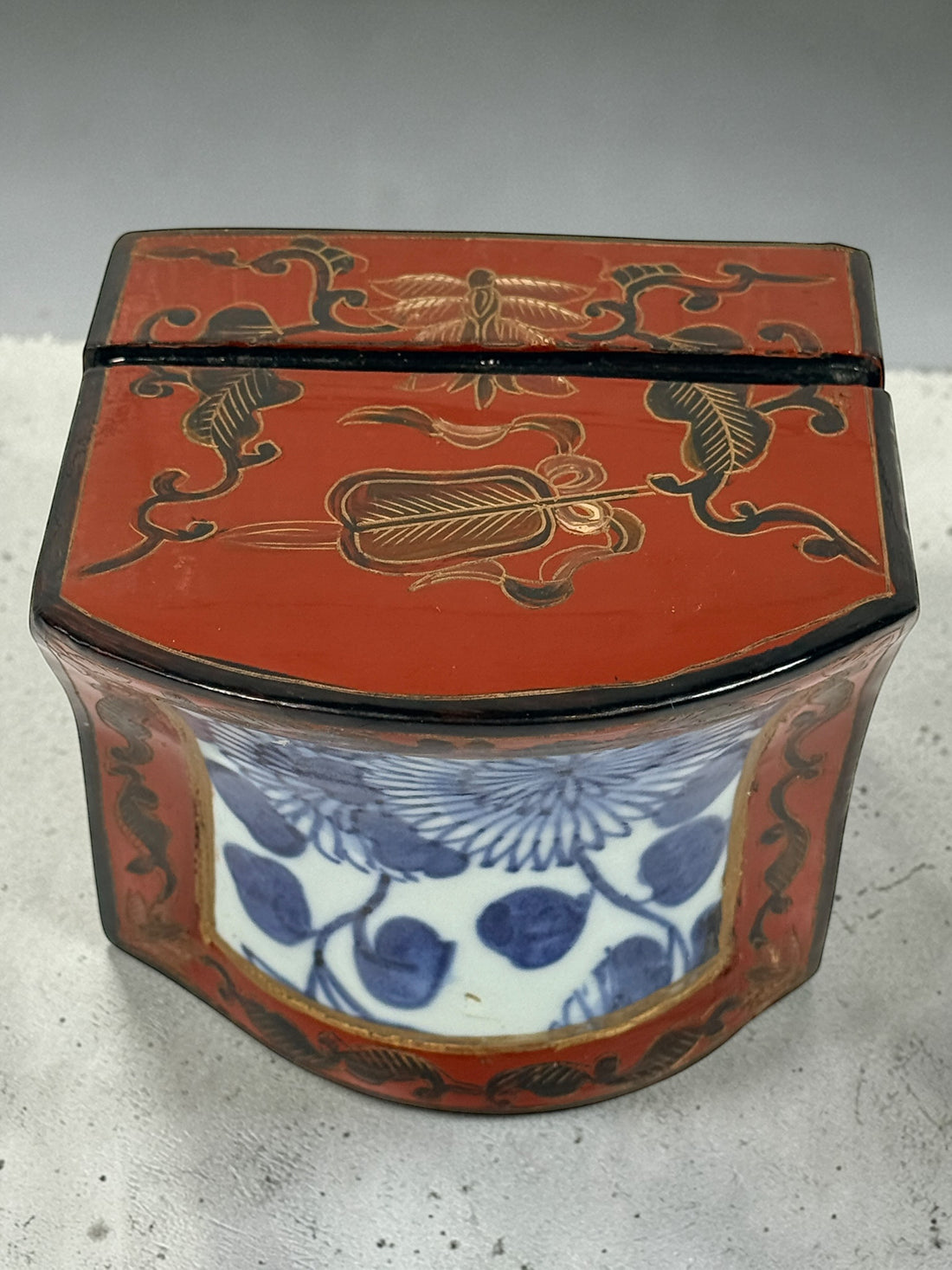 Chinese lacquer jewelry box with porcelain floral panel, red and gold decorative trinket box, vintage Asian decor storage piece, elegant display accent.