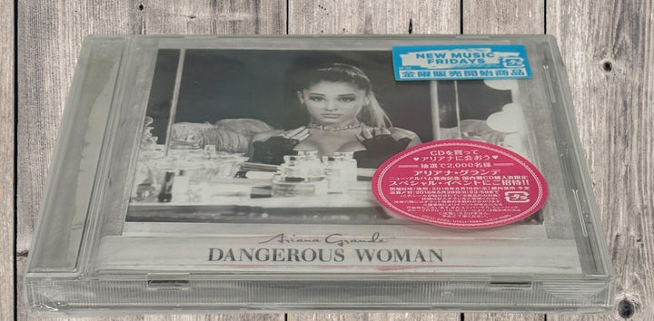 Sealed Japan pressing Ariana Grande Dangerous Woman CD import edition. Collectible 2016 pop album with Japanese release packaging and original retail sticker.