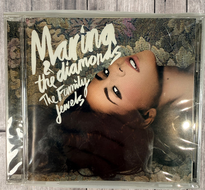 2010 Japan pressing of Marina &amp; The Diamonds The Family Jewels CD WPCR-13832. Includes bonus content. Clean copy, collectible alt pop release.
