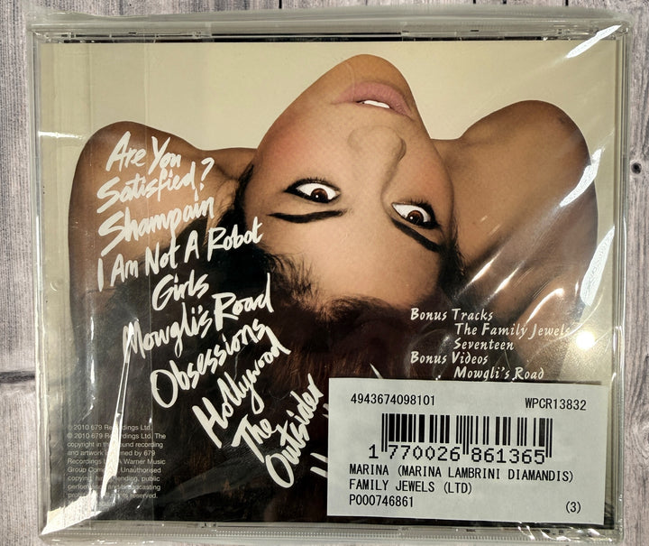 2010 Japan pressing of Marina &amp; The Diamonds The Family Jewels CD WPCR-13832. Includes bonus content. Clean copy, collectible alt pop release.