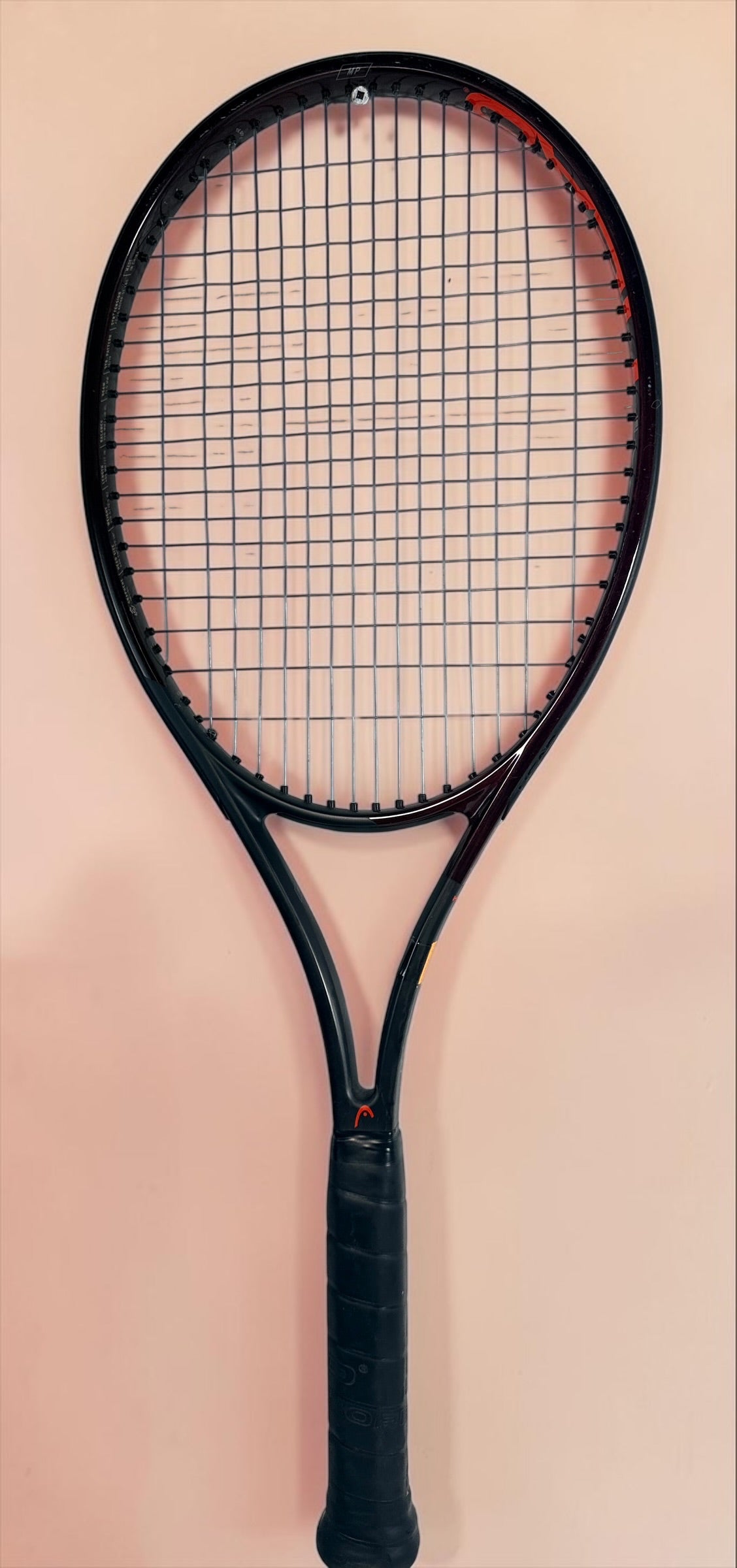 HEAD Prestige MP tennis racquet with Auxetic technology. Pre-owned and strung with visible cosmetic wear. Premium control racquet for experienced players.