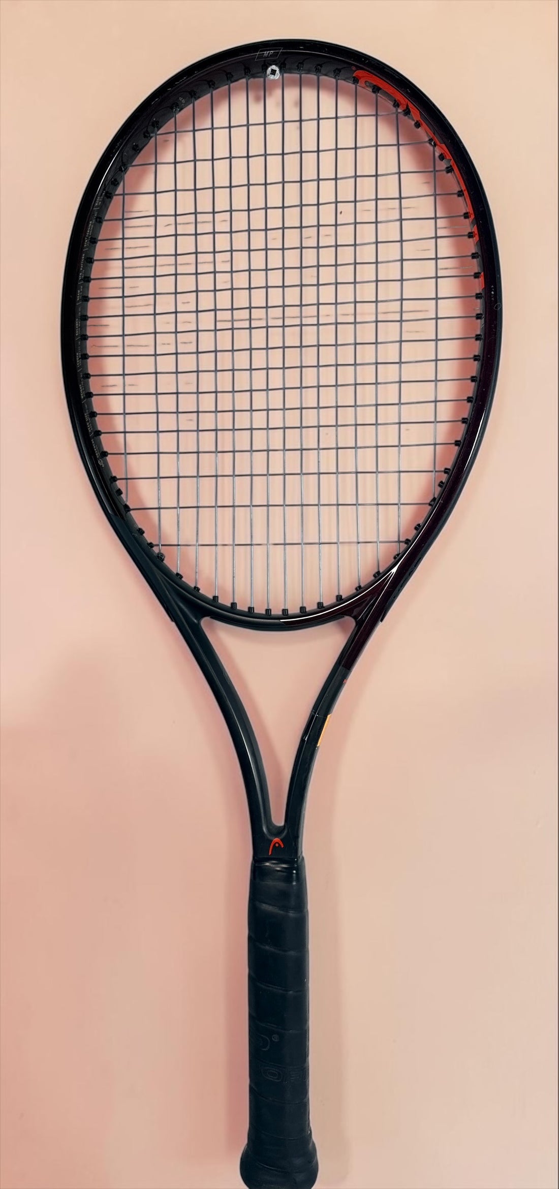 HEAD Prestige MP tennis racquet with Auxetic technology. Pre-owned and strung with visible cosmetic wear. Premium control racquet for experienced players.