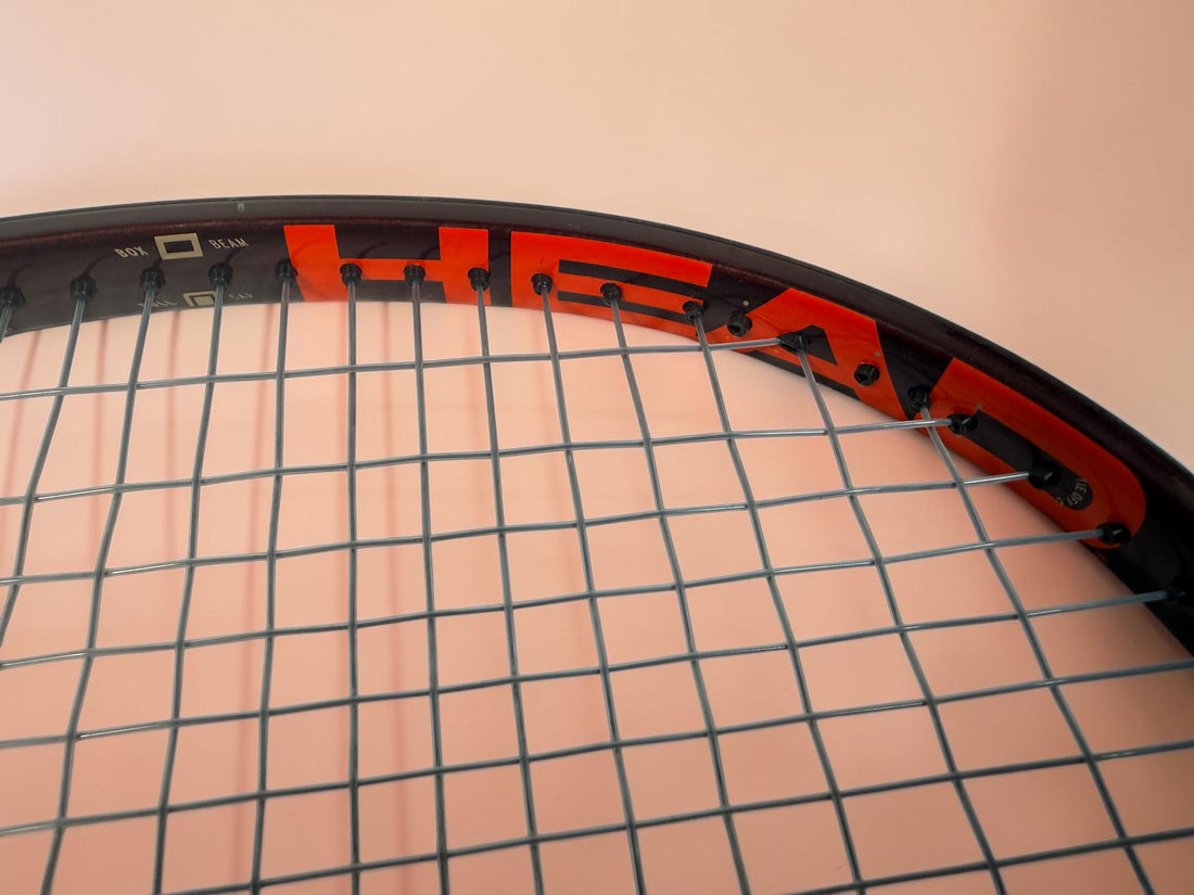 HEAD Prestige MP tennis racquet with Auxetic technology. Pre-owned and strung with visible cosmetic wear. Premium control racquet for experienced players.