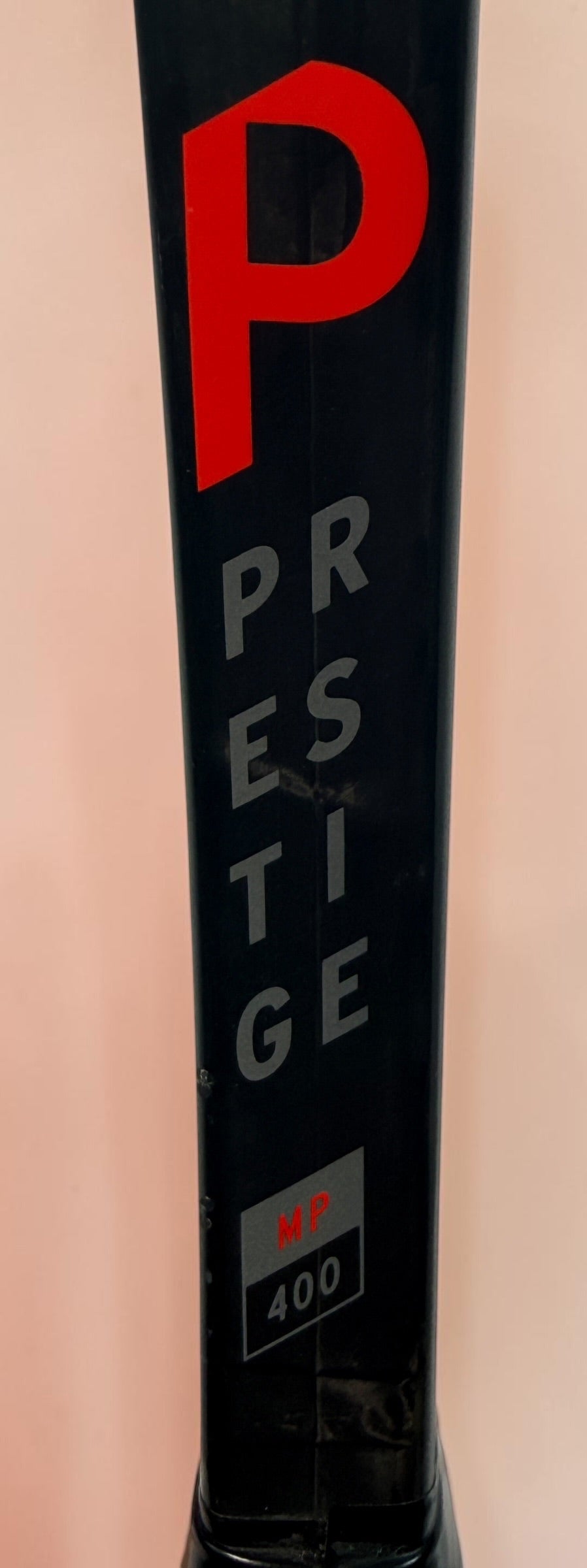 HEAD Prestige MP tennis racquet with Auxetic technology. Pre-owned and strung with visible cosmetic wear. Premium control racquet for experienced players.