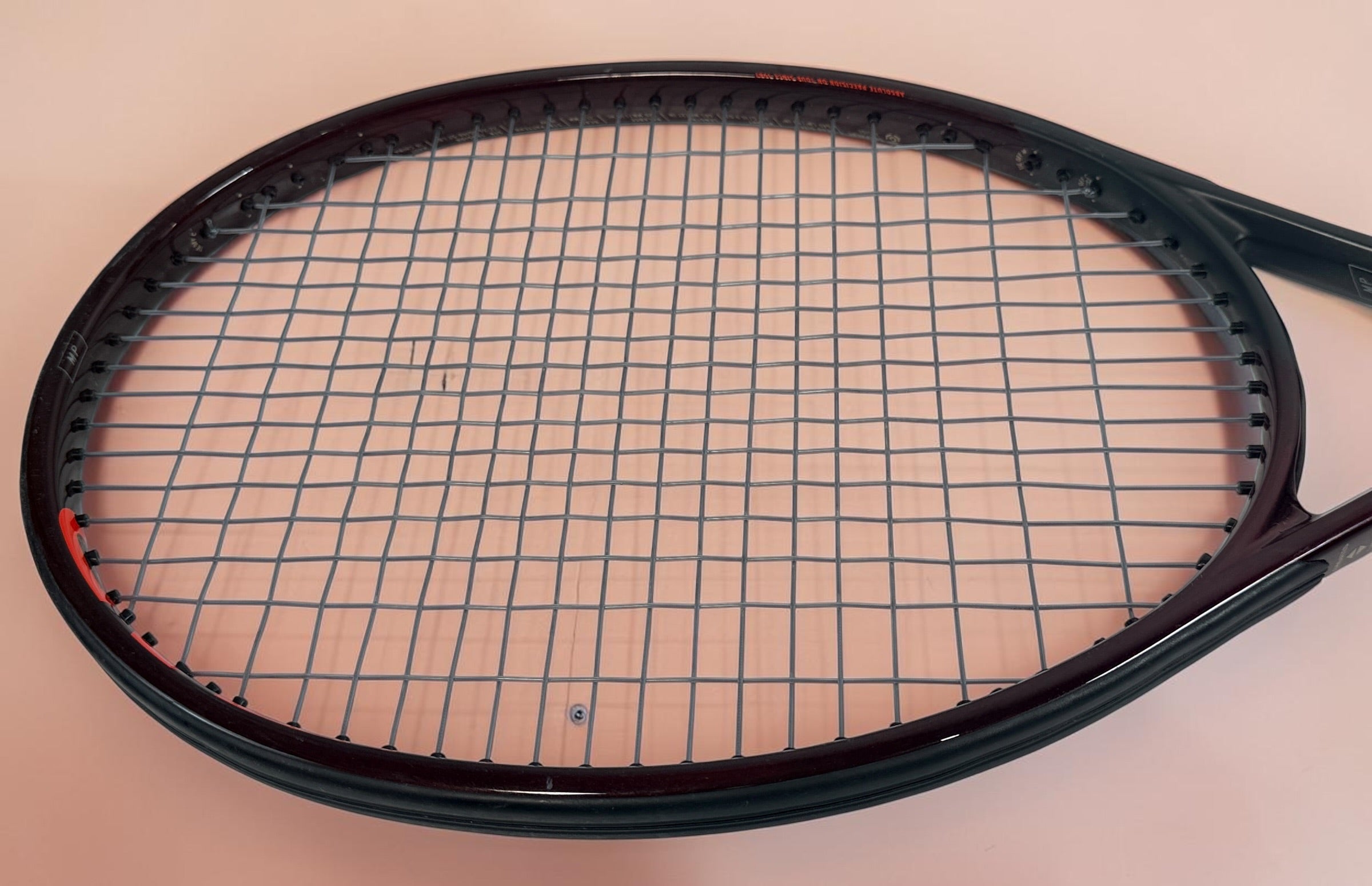 HEAD Prestige MP tennis racquet with Auxetic technology. Pre-owned and strung with visible cosmetic wear. Premium control racquet for experienced players.