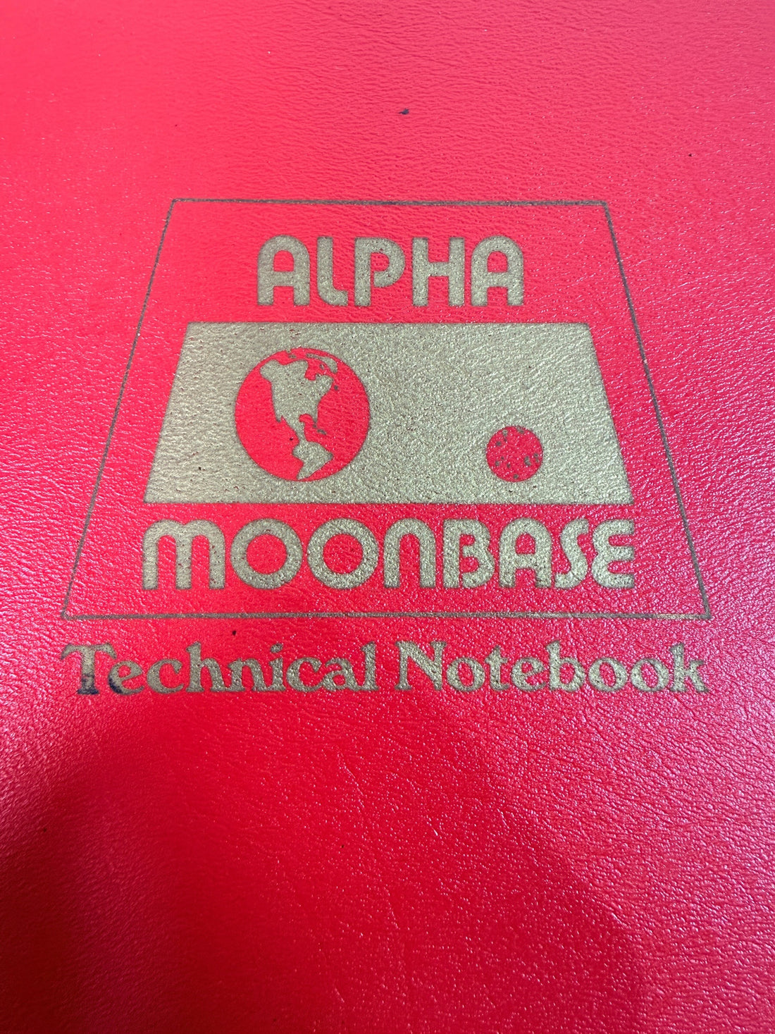 1977 Space: 1999 Moonbase Alpha Technical Notebook, first printing by Starlog. Illustrated vintage reference in red binder. See condition and completeness notes.
