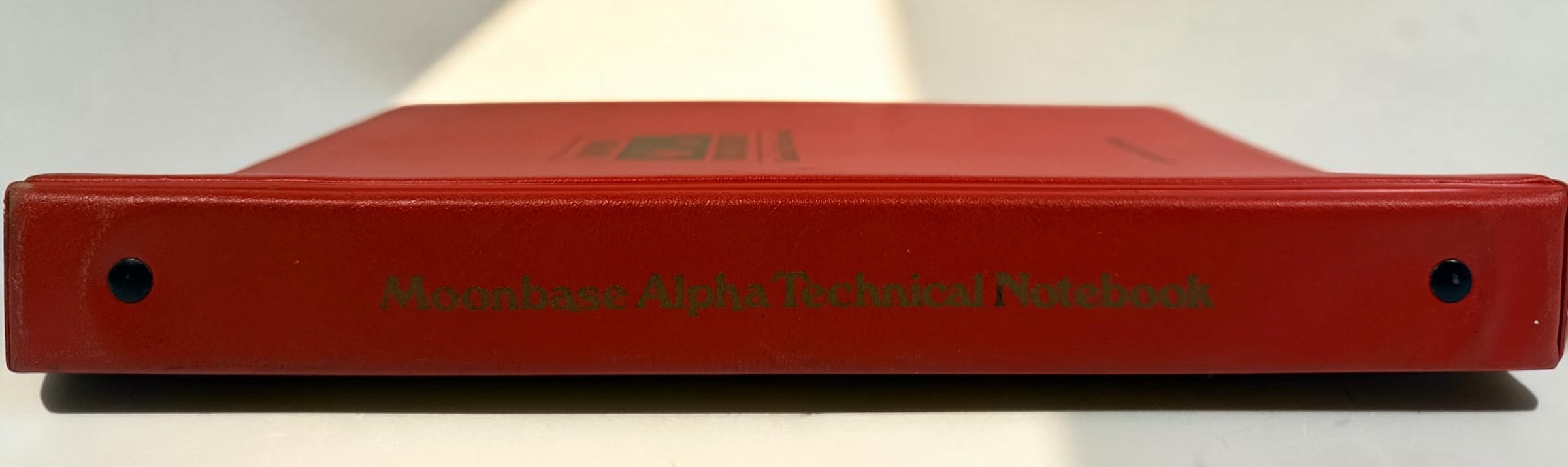 1977 Space: 1999 Moonbase Alpha Technical Notebook, first printing by Starlog. Illustrated vintage reference in red binder. See condition and completeness notes.