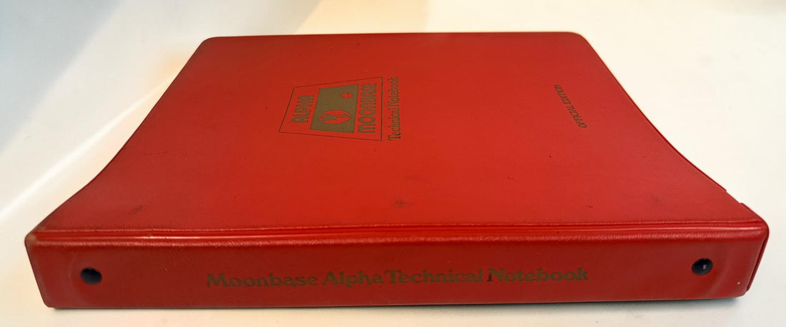 1977 Space: 1999 Moonbase Alpha Technical Notebook, first printing by Starlog. Illustrated vintage reference in red binder. See condition and completeness notes.