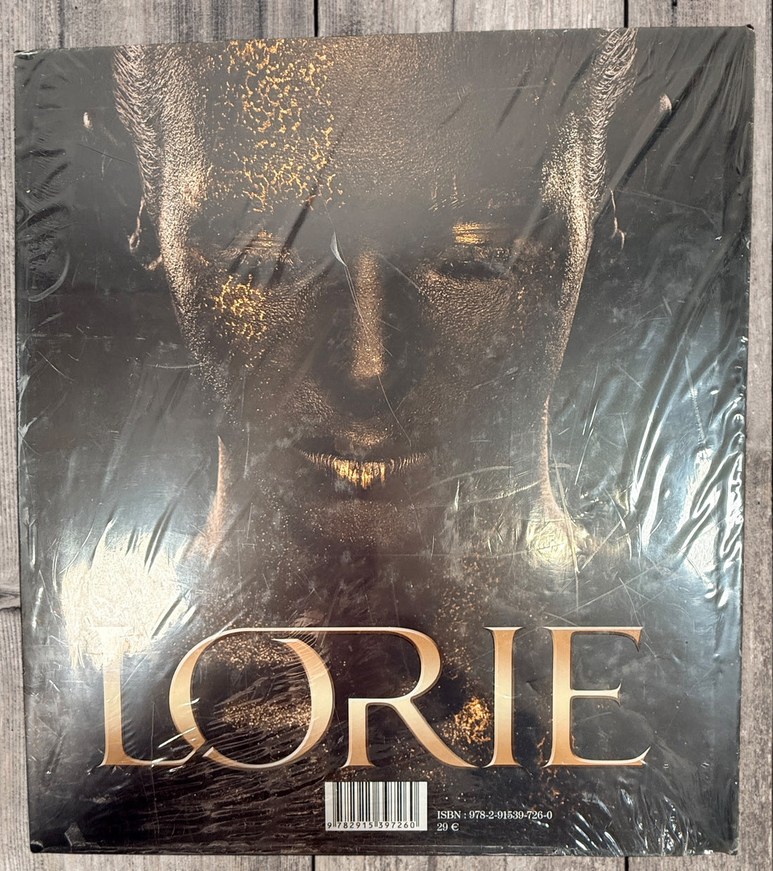 Sealed Lorie hardcover photo book featuring 100+ rare and unpublished images. Large-format French pop collector edition in excellent condition.