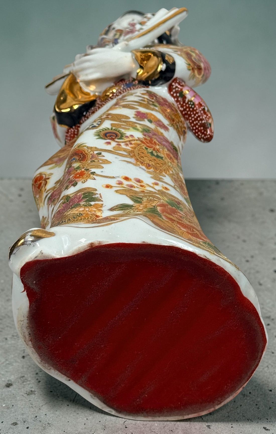 Vintage Japanese porcelain geisha figurine with hand-painted florals and raised gilt moriage detail. Elegant mid-century decorative display piece