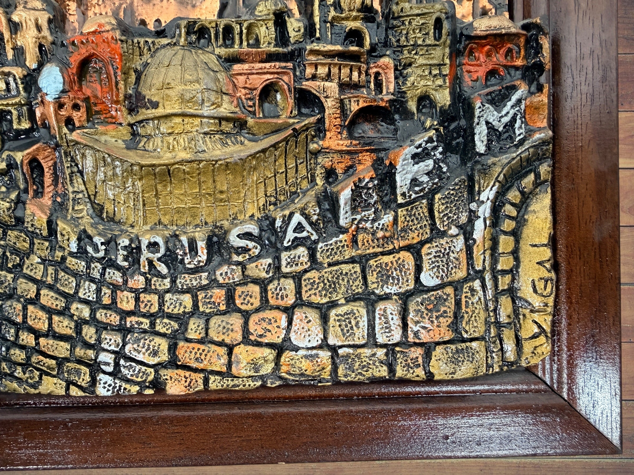 Vintage Yigal Jerusalem 3D relief plaque, framed Israeli Judaica wall art, 15x12.5 inch sculptural cityscape décor in good condition.