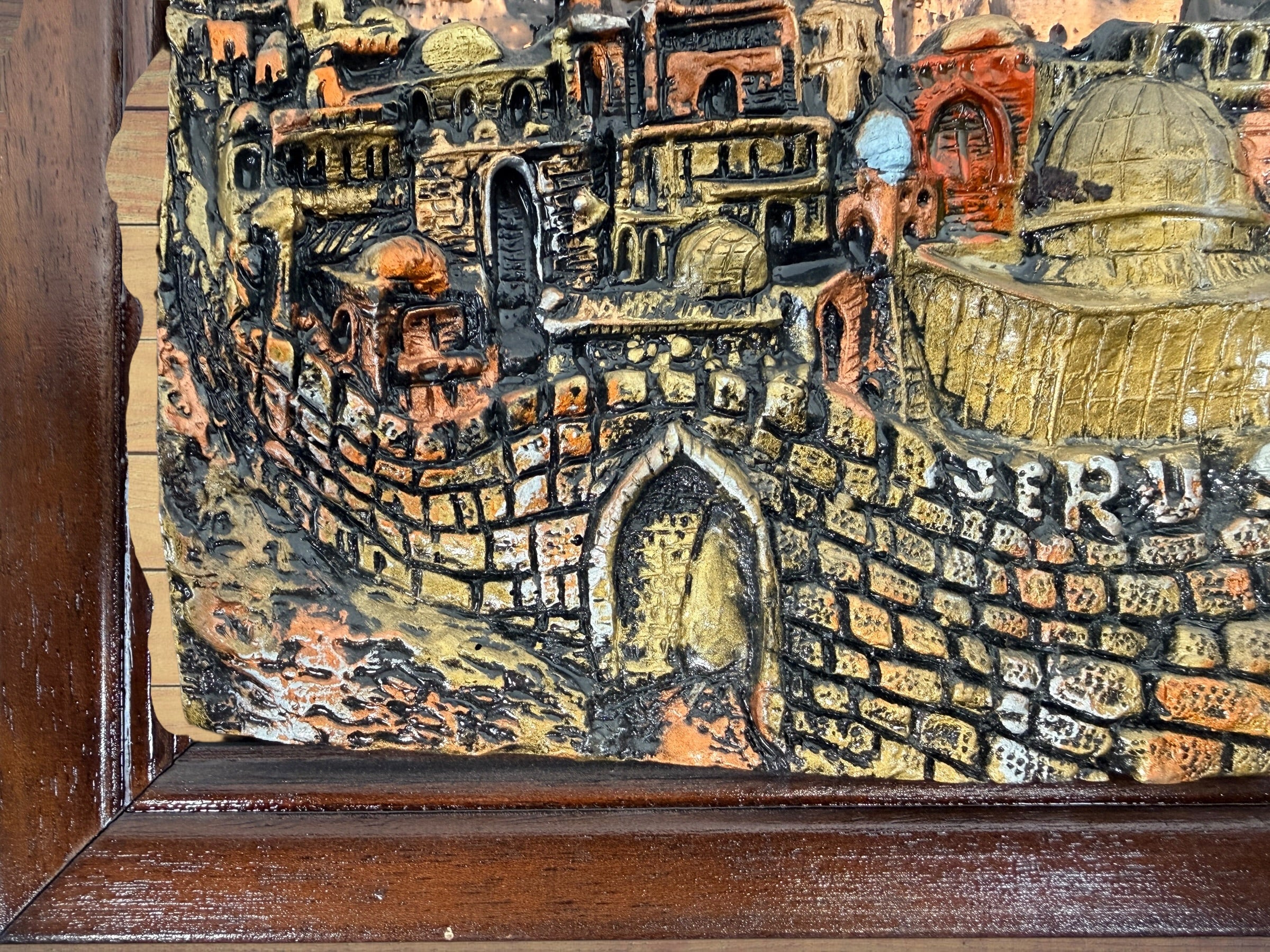 Vintage Yigal Jerusalem 3D relief plaque, framed Israeli Judaica wall art, 15x12.5 inch sculptural cityscape décor in good condition.