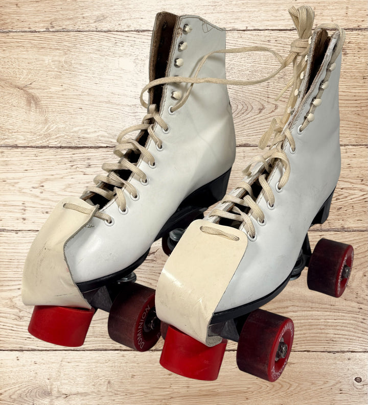 Vintage Dominion Canada quad roller skates with Marathon plates and red Precision wheels. White leather boots, women’s 8.5–9, classic Canadian rink style.