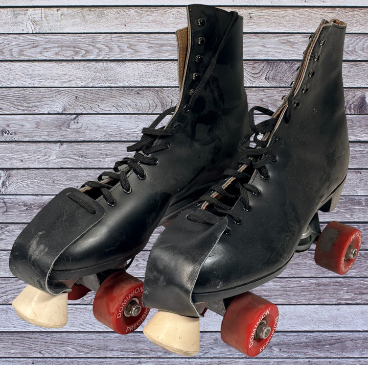 Vintage Dominion Canada leather roller skates, black quad setup with original Dominion Precision wheels. Classic rink style, estimated men’s size 10.