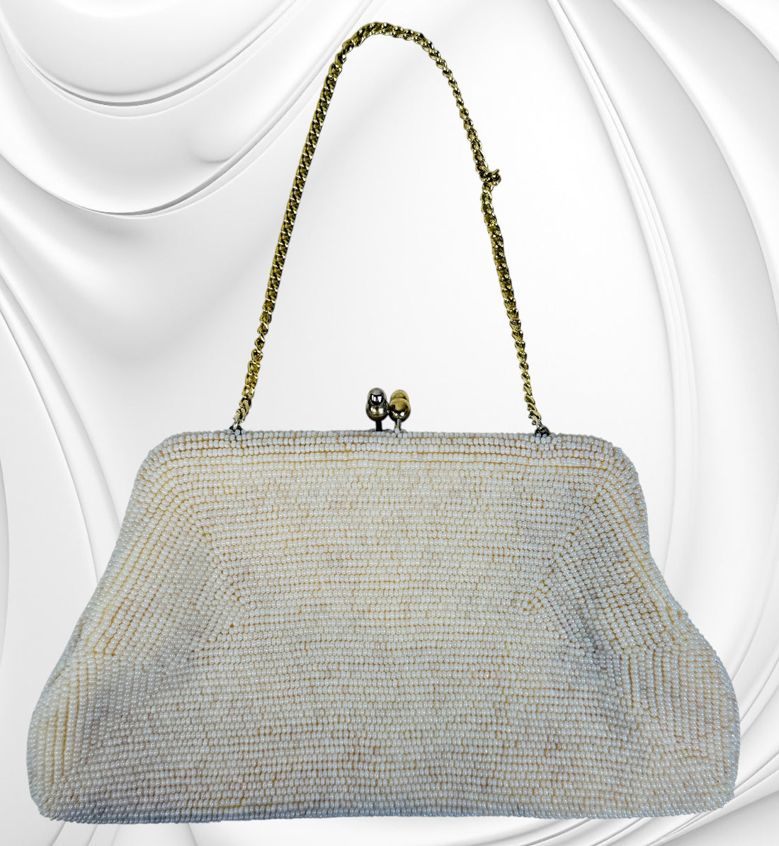 Vintage Birks white beaded evening clutch made in Japan with gold frame and chain strap. Elegant bridal or formal handbag in very good condition.