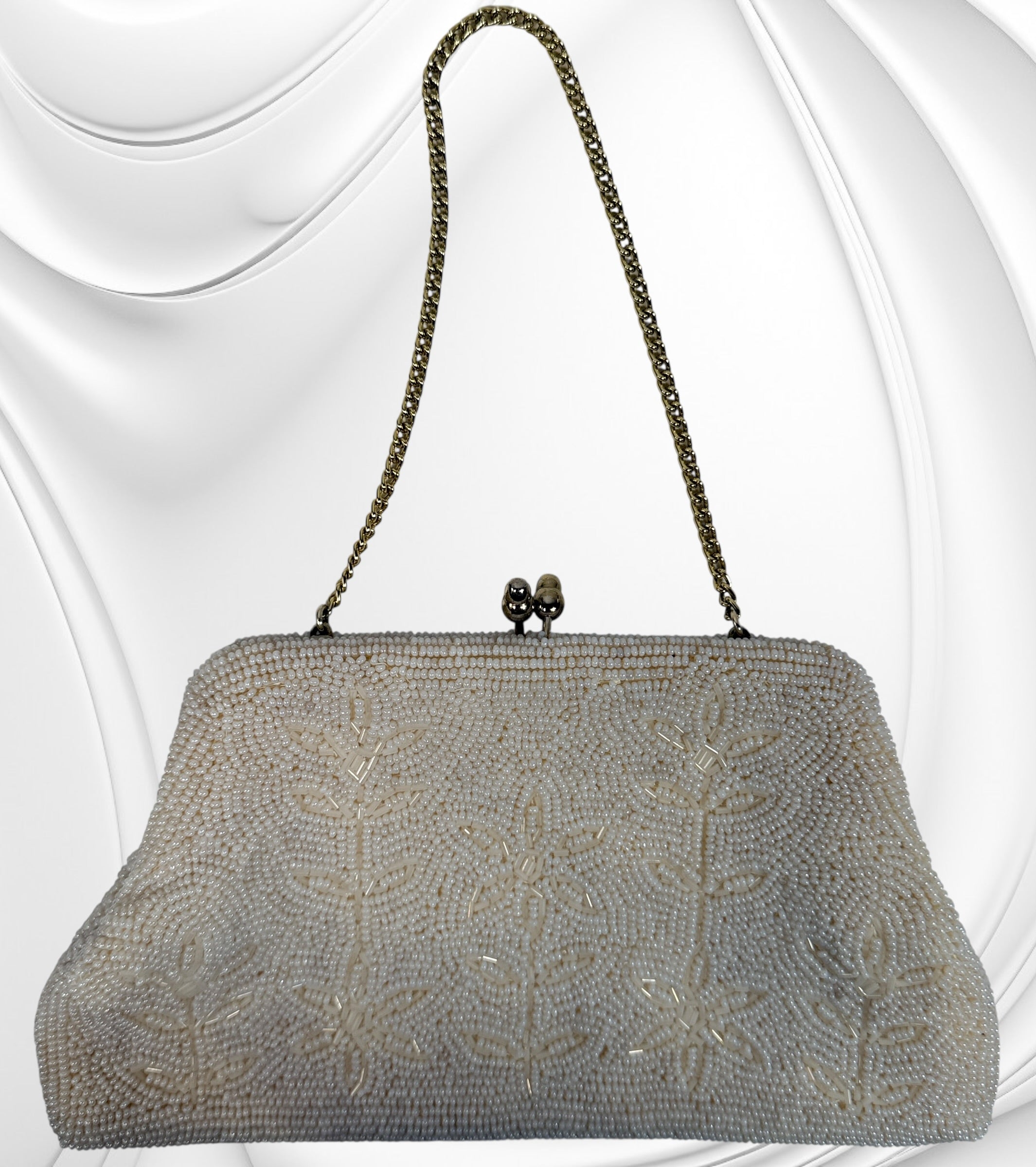 Vintage Birks white beaded evening clutch made in Japan with gold frame and chain strap. Elegant bridal or formal handbag in very good condition.