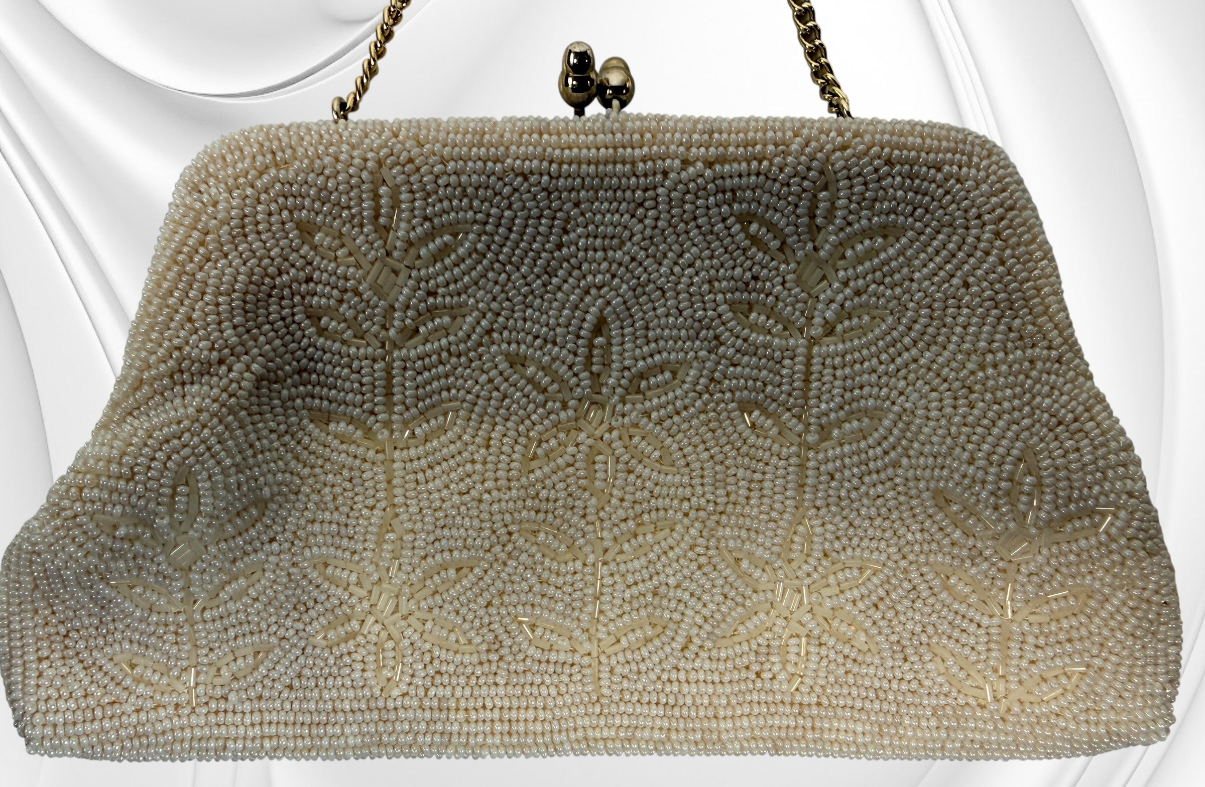 Vintage Birks white beaded evening clutch made in Japan with gold frame and chain strap. Elegant bridal or formal handbag in very good condition.