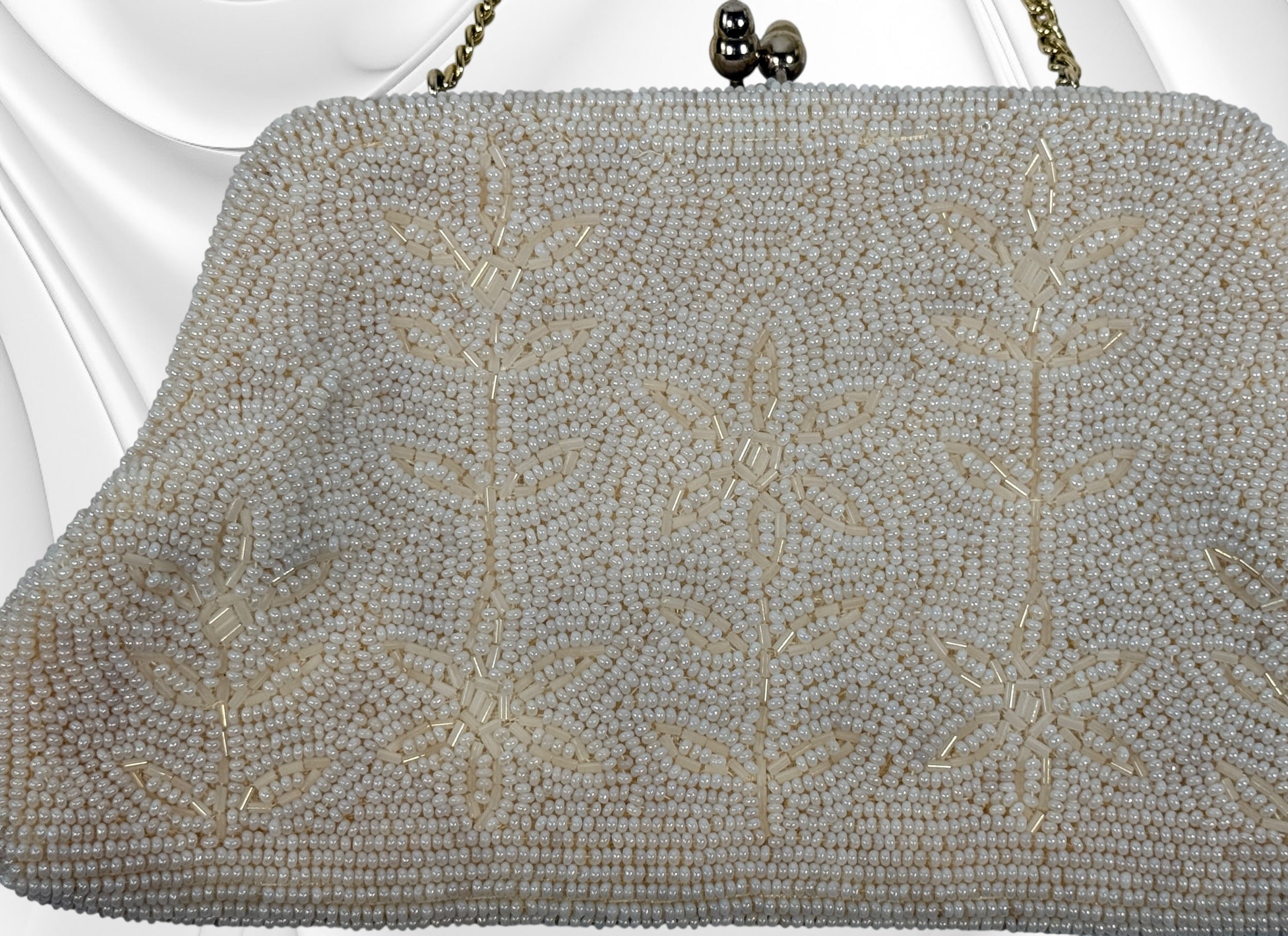 Vintage Birks white beaded evening clutch made in Japan with gold frame and chain strap. Elegant bridal or formal handbag in very good condition.