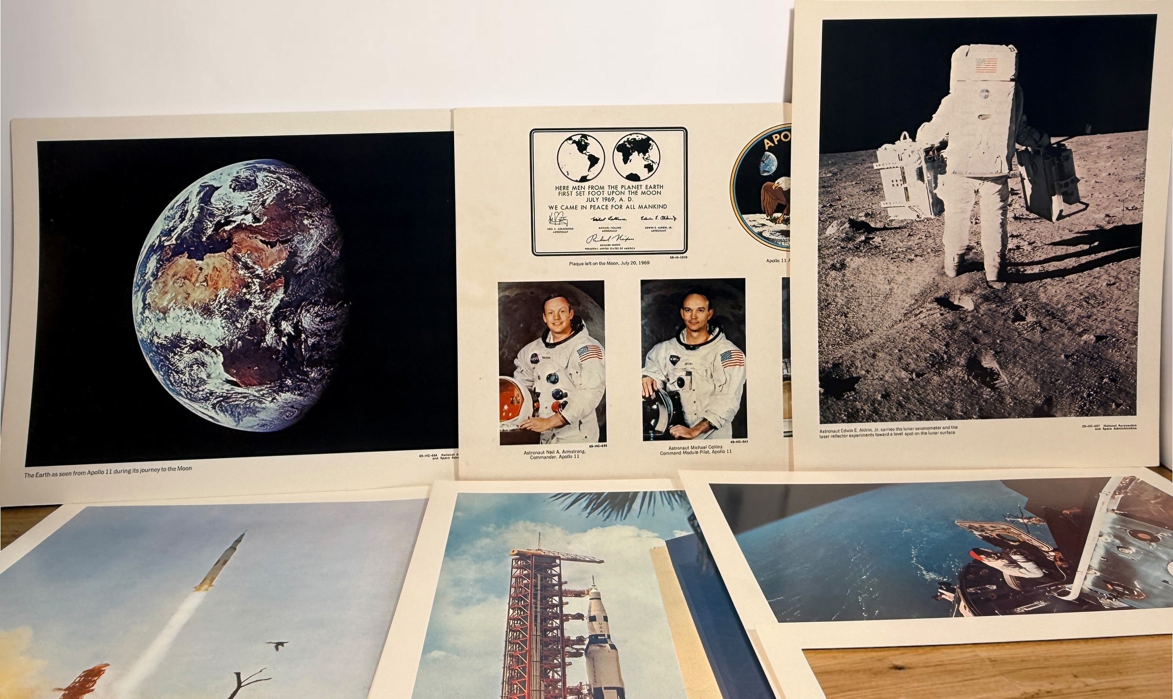 Vintage NASA Apollo lithograph collection with 19 official 11x14 prints and original U.S. Government Printing Office mailing envelope. Apollo 8–11.