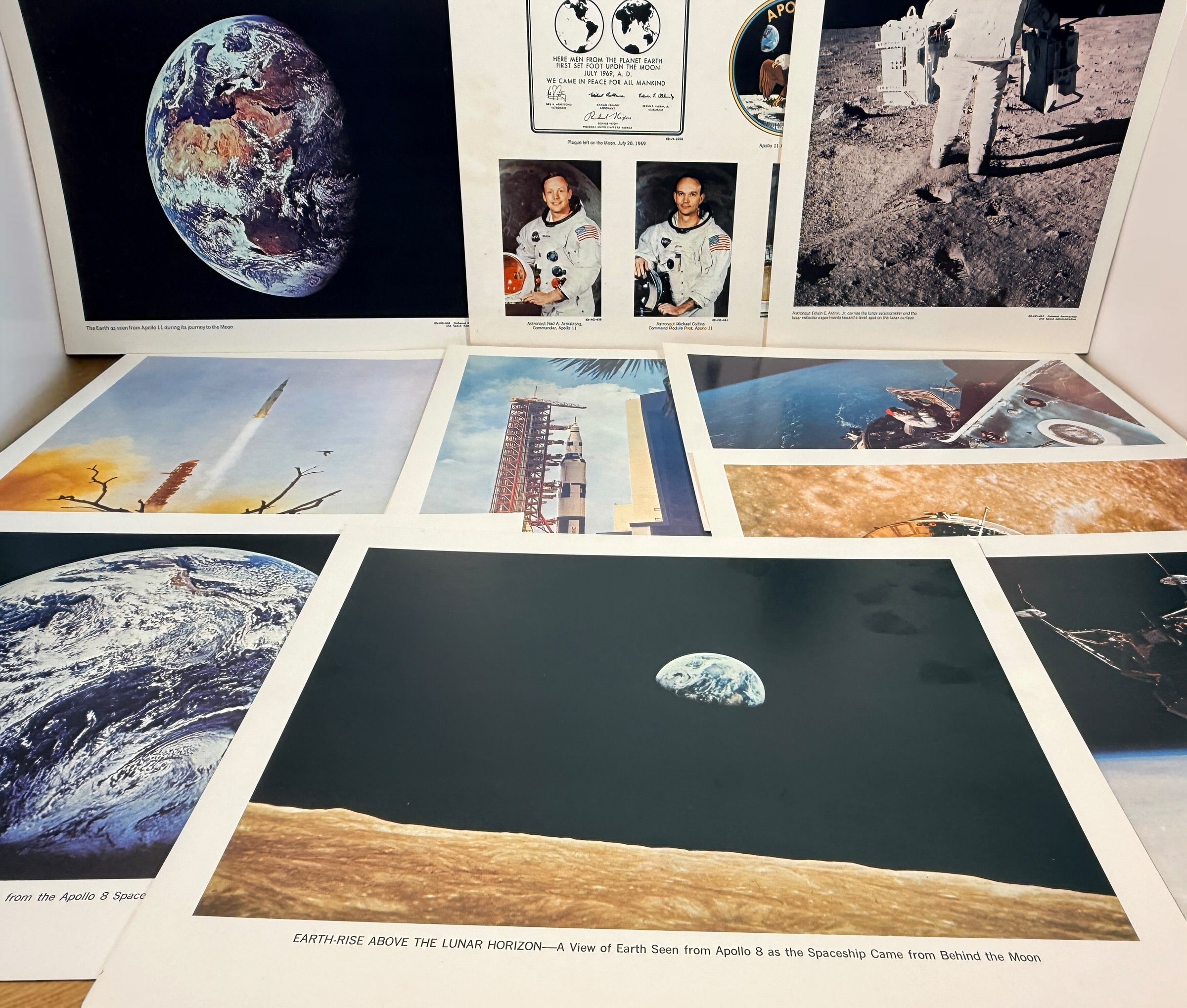 Vintage NASA Apollo lithograph collection with 19 official 11x14 prints and original U.S. Government Printing Office mailing envelope. Apollo 8–11.