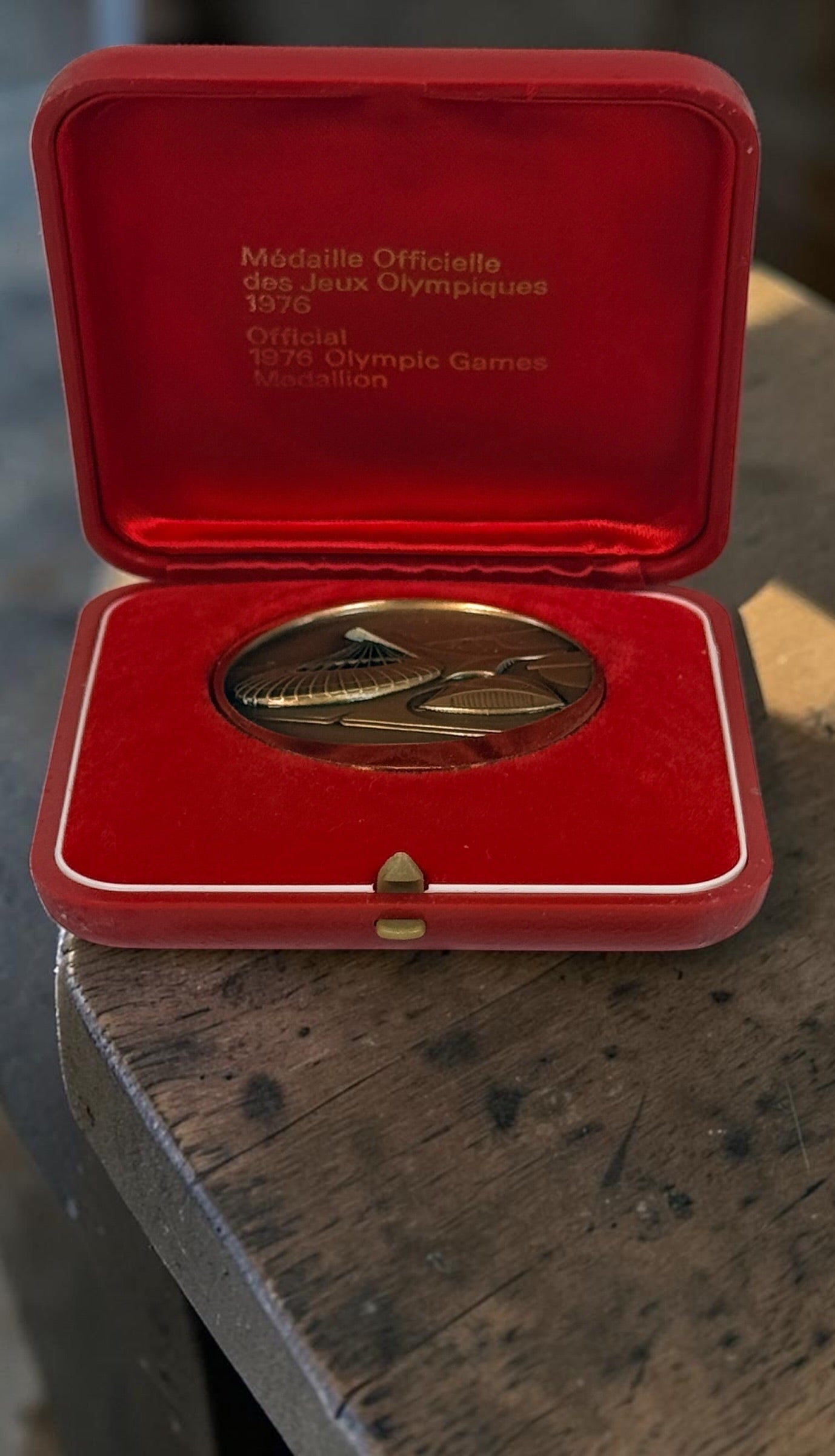 Official 1976 Montréal Olympics bronze medallion by Huguenin Switzerland with original red case and numbered COA #013824. Vintage Olympic collectible.